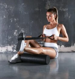 PTP Fascia Release Foam Roller - Medium - 45cm (with Stretching Strap) 9 PTP Fascia Release Foam Roller - Medium - 45cm (with Stretching Strap) -Fitness Supplies Store PTP Fascia Release Foam Roller Mini 45cm with Stretching Strap Action Shot