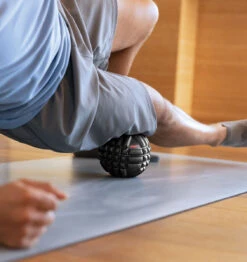 TriggerPoint GRID X Massage Ball - 5" - Black -Fitness Supplies Store TriggerPoint GRID Massage Ball X Black Lifestyle 02