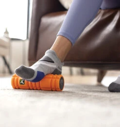 TriggerPoint NANO VIBE Vibrating Foam Roller - 7.5" - Orange 30 TriggerPoint NANO VIBE Vibrating Foam Roller - 7.5" - Orange -Fitness Supplies Store TriggerPoint Nano Vibe Vibrating Foam Roller Lifestyle 01