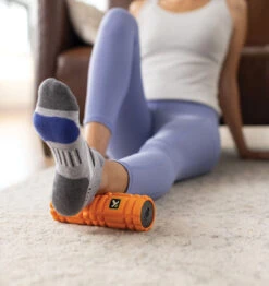 TriggerPoint NANO VIBE Vibrating Foam Roller - 7.5" - Orange 32 TriggerPoint NANO VIBE Vibrating Foam Roller - 7.5" - Orange -Fitness Supplies Store TriggerPoint Nano Vibe Vibrating Foam Roller Lifestyle 03