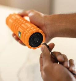 TriggerPoint NANO VIBE Vibrating Foam Roller - 7.5" - Orange 41 TriggerPoint NANO VIBE Vibrating Foam Roller - 7.5" - Orange -Fitness Supplies Store TriggerPoint Nano Vibe Vibrating Foam Roller Lifestyle 11